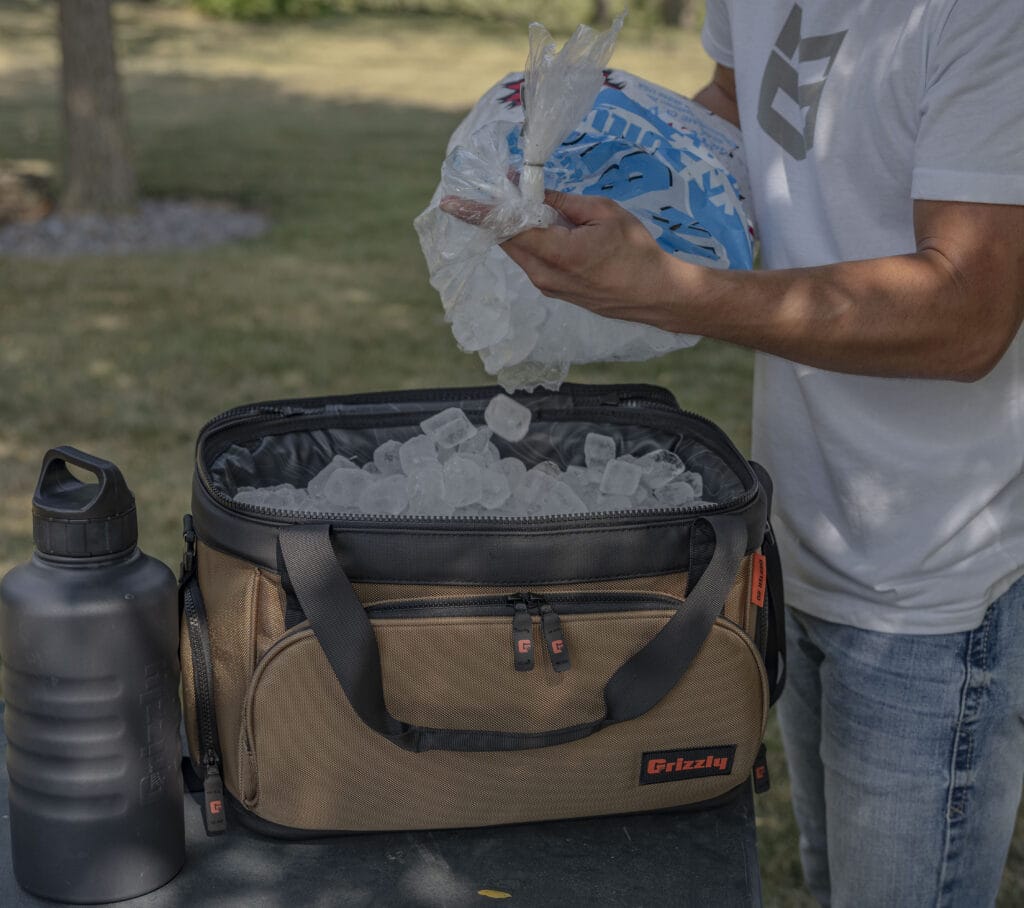 types of ice, cubed ice being added to a drifter 20 soft sided cooler