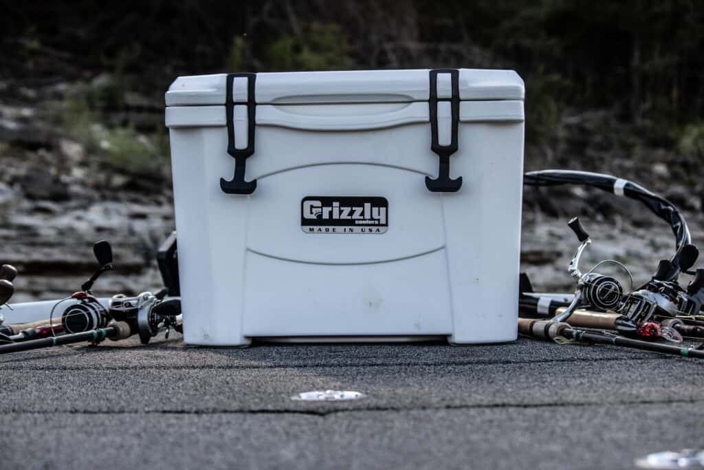grizzly cooler with fishing gear on boat