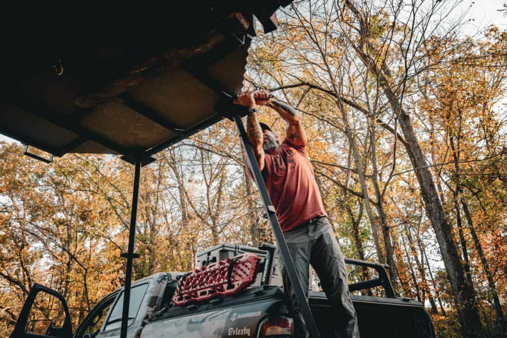 Setting up an elevated hunting blind from grizzly coolers