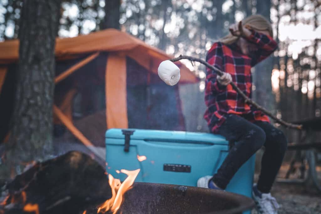 roasting marshmallow while camping