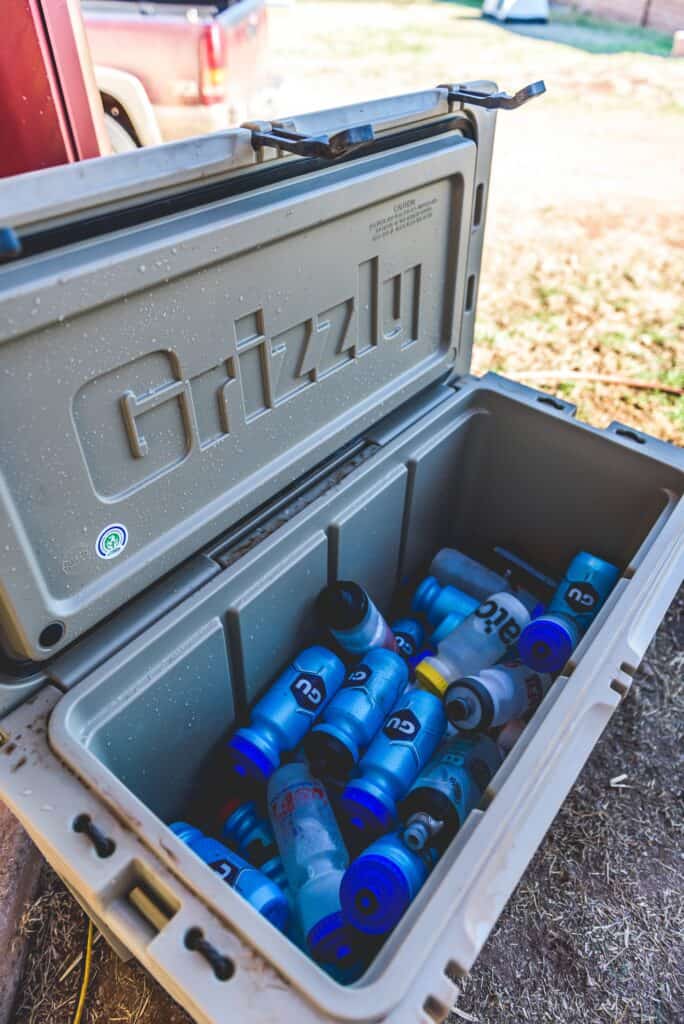 grizzly cooler working on the job site, opened and filled with cold water bottles