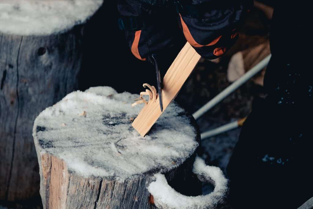 making kindling with an axe