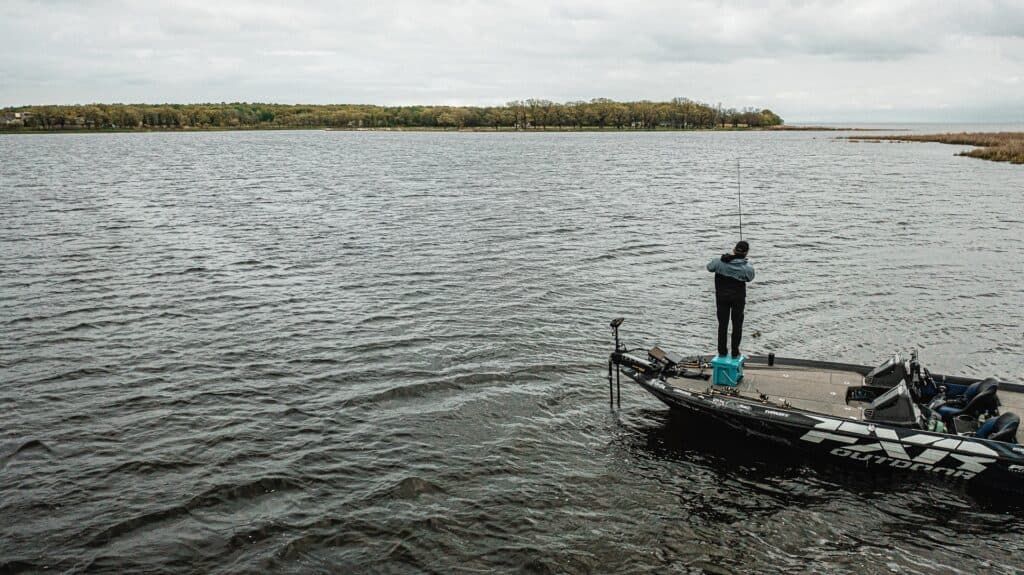mille lacs lake fishing with matt peters standing on grizzly 20 cooler, landscape image