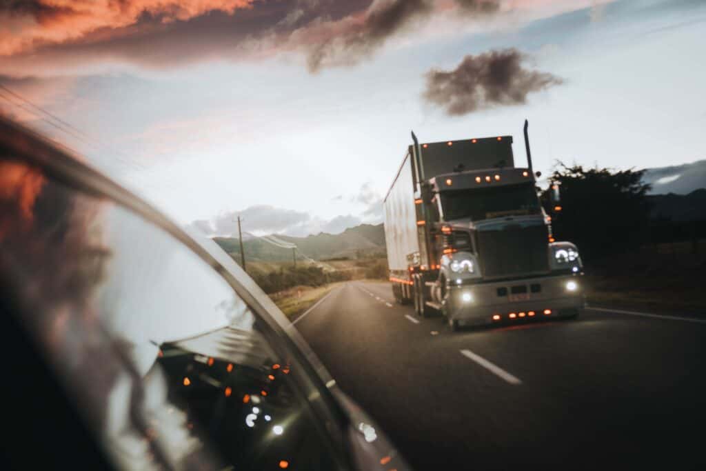 18-wheeler semi truck driving down road