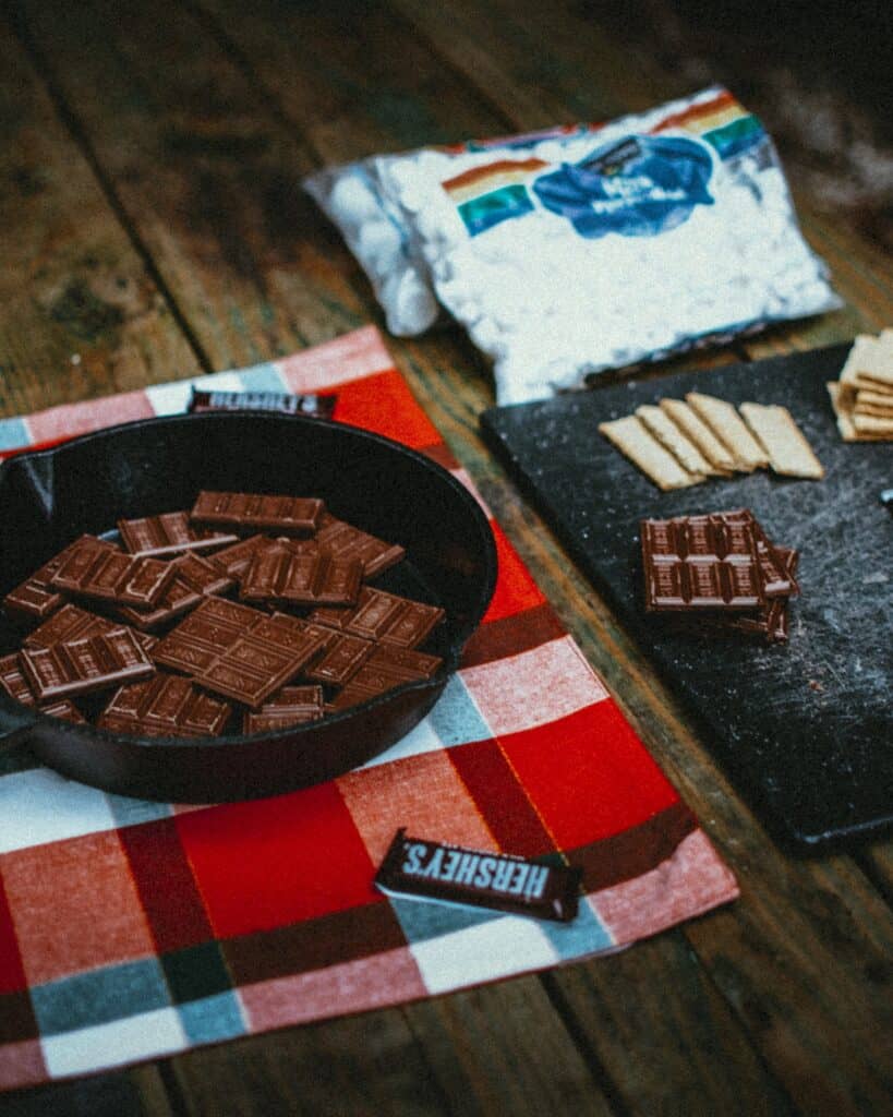 cast iron camping recipes melting hershey chocolate bars in skillet